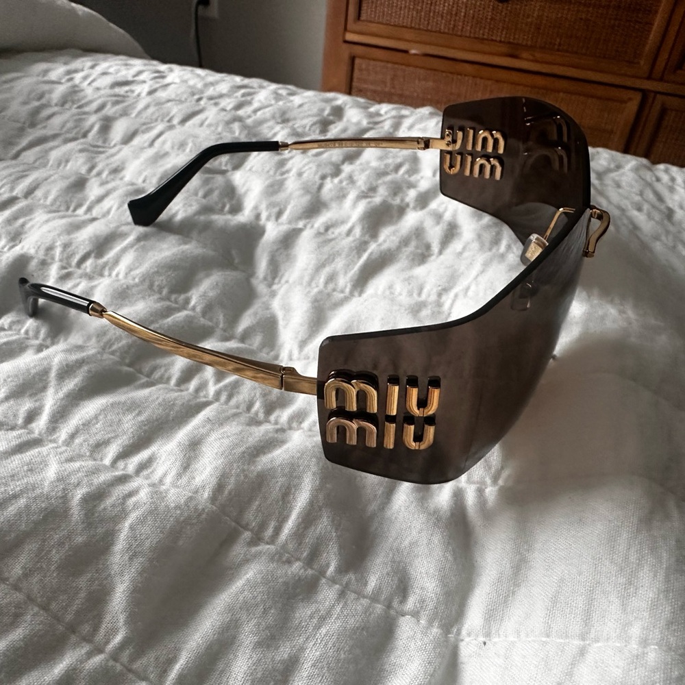 Miu Miu Black and Gold Sunglasses